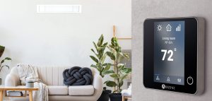 Google Nest smart thermostat mounted on wall with mobile app control – energy-saving device